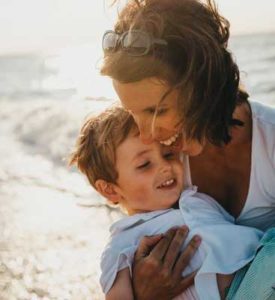 Mother hugging child